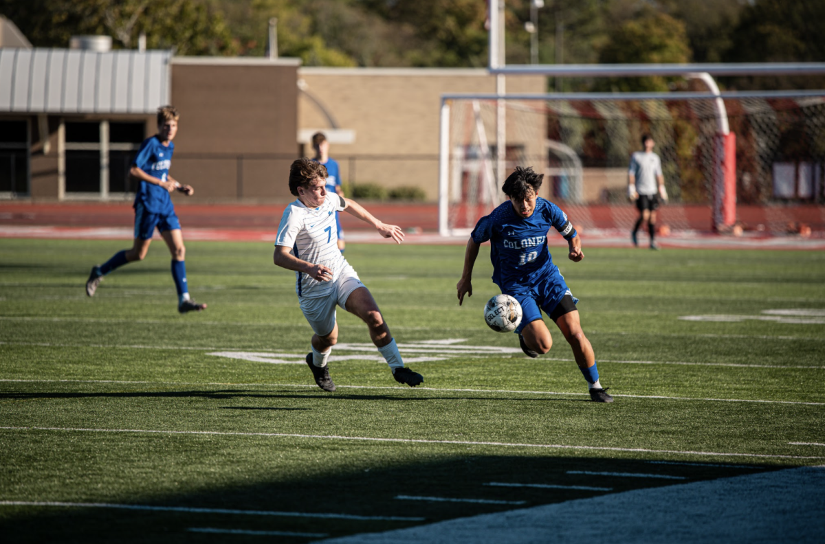 Craig Miller (12) chases after the ball.